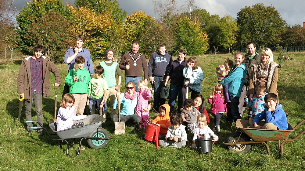 Happy planters in the community orchard